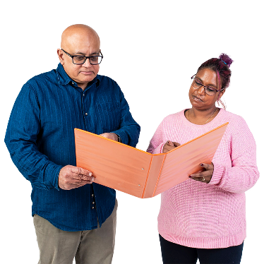 2 people looking at a folder together.
