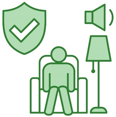 A person sitting in an armchair next to a standing lamp, a low volume icon, and a safety icon.