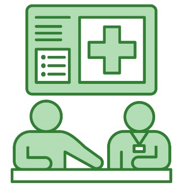 2 people sitting at a desk together. 1 of them is pointing to a document on the desk. There is a hospital sign above them.