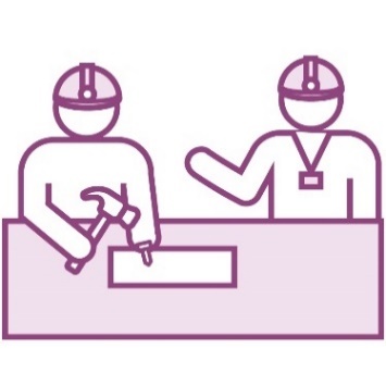 A person teaching a student how to do woodwork.