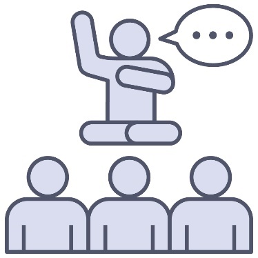 An Aboriginal elder speaking to a group of 3 people.