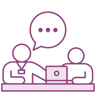 A person wearing a lanyard supporting a child using a laptop.