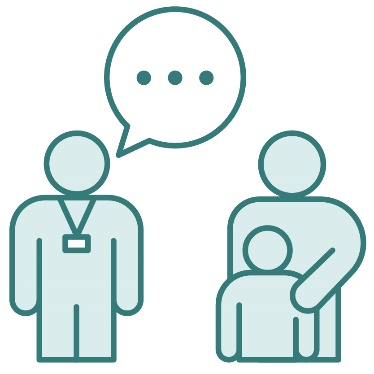 A person wearing a lanyard supporting a parent with their child.