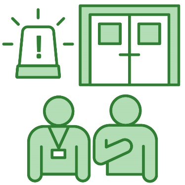 A person wearing a lanyard supporting someone in an emergency department at a hospital.