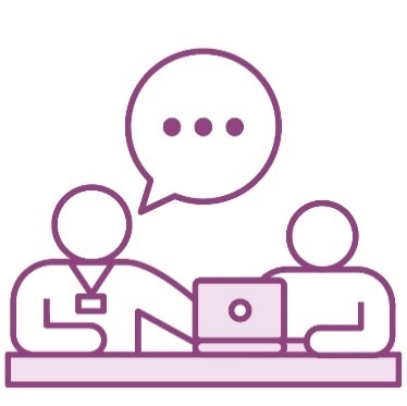 A person wearing a lanyard supporting a child using a laptop.