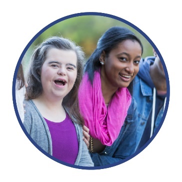 A group of people outside in their community. 