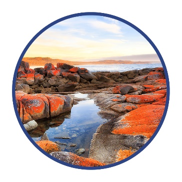 A picture of Country that shows rocks around a river.