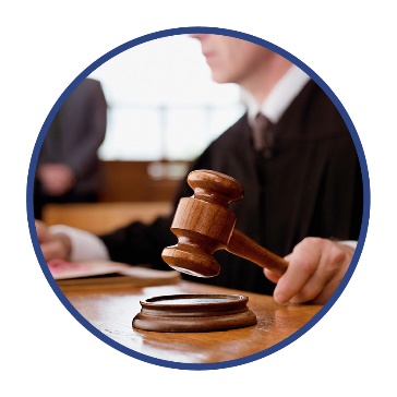 A judge hitting a gavel.