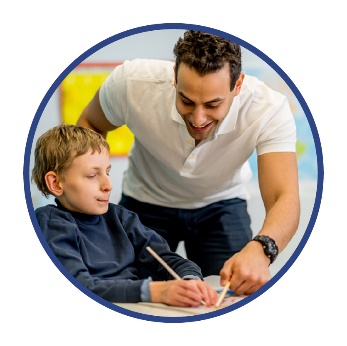 A teacher supporting a student with disability. 
