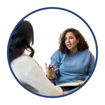 A person meeting with a healthcare worker.